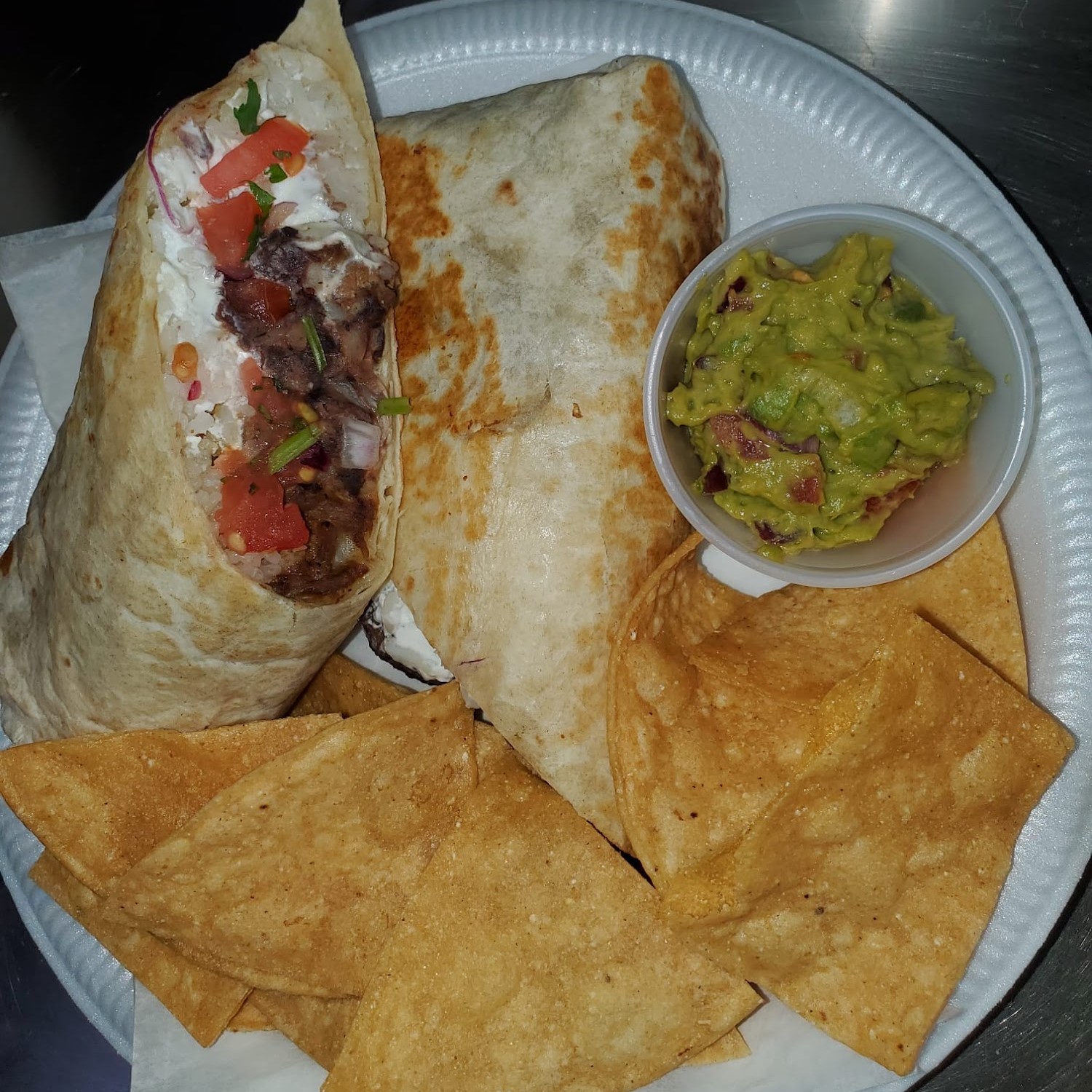 El Torito Deli burrito with house chips and guacamole — made to order, all day